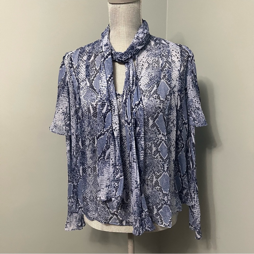 DIANE VON FURSTENBURG blue flowy blouse semi sheer women’s size 4 animal print